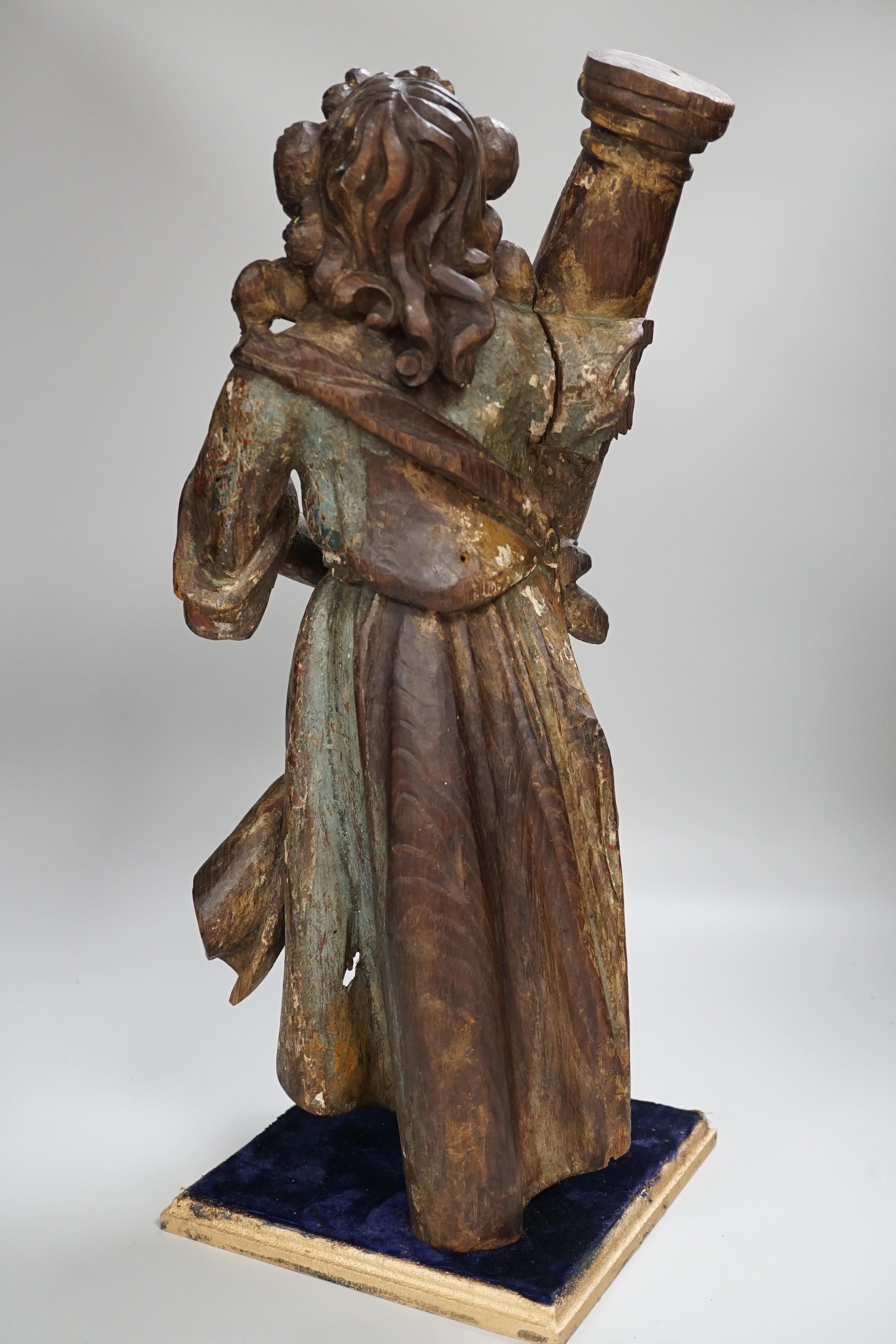 A carved wood polychrome model of a Saint, 53cm